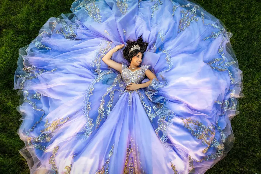 Crowned in blue and gold — every fold of the gown placed like a work of art.